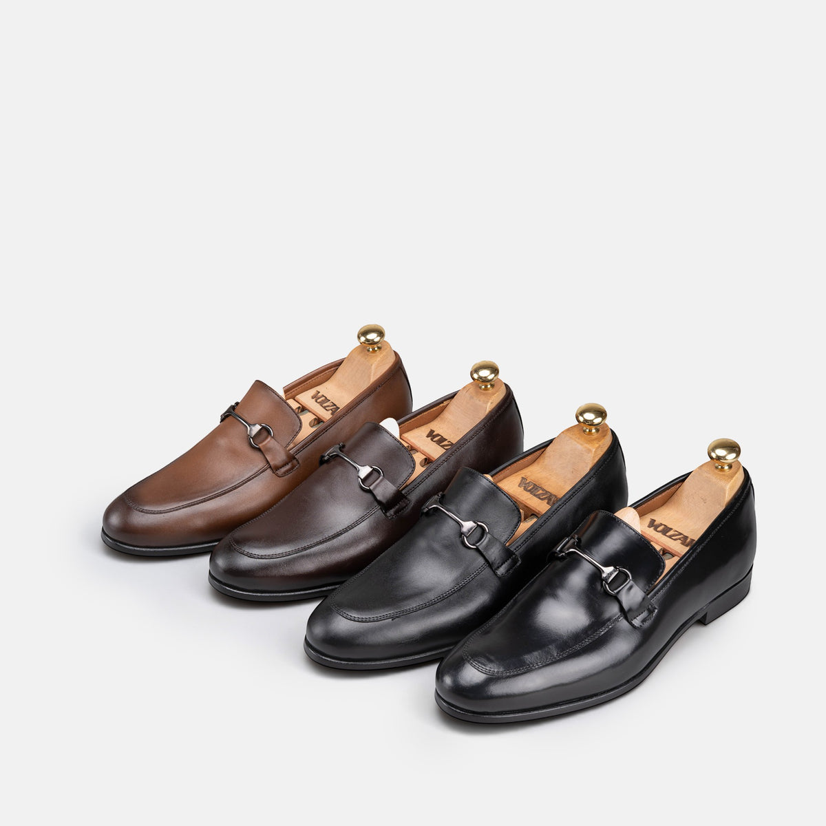 VOLZAK leather loafers in black and brown shades with metal horsebit detail and wooden shoe trees